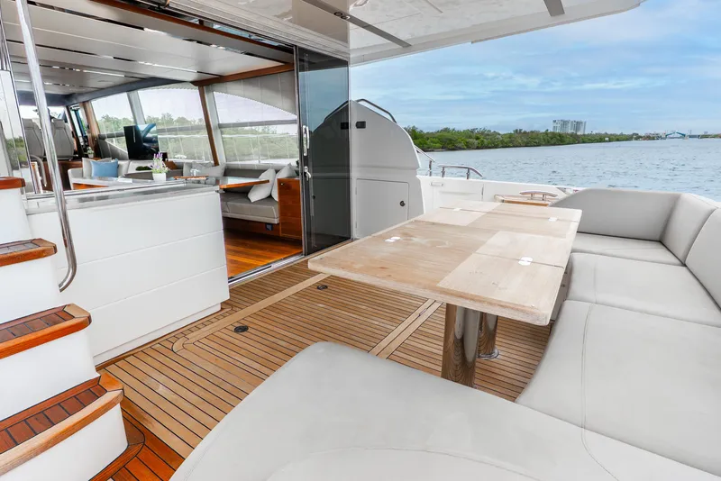 Slide: The Image of Luxurious 2018 Princess F-68 yacht interior with elegant seating and wooden flooring. - 18