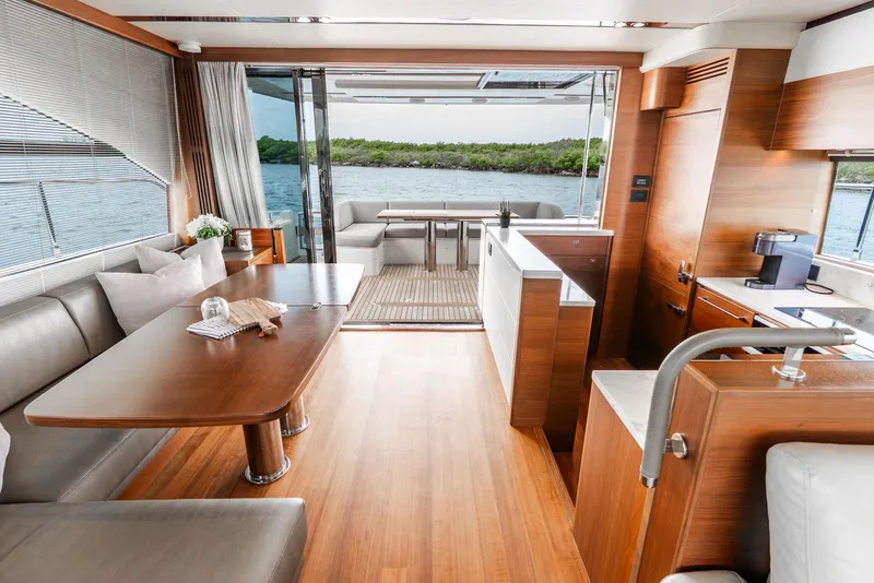 Slide: The Image of Luxurious interior of 2018 Princess F-68 yacht with modern seating and kitchenette. - 19