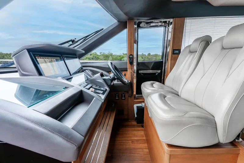 Slide: The Image of Luxurious interior of 2018 Princess F-68 yacht with elegant wood finishes and scenic water view. - 28