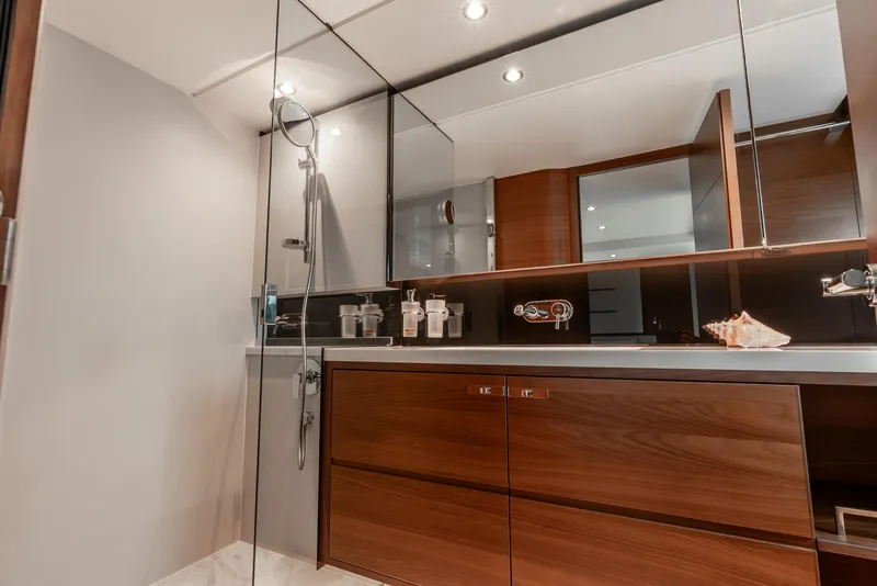 Slide: The Image of Luxurious interior of 2018 Princess F-68 yacht with white leather seating and panoramic windows. - 38