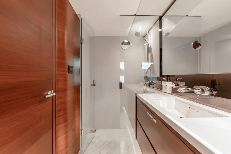 Slide: The Image of Luxurious bathroom interior on 2018 Princess F-68 yacht with modern wood cabinetry and sleek fixtures. - 46