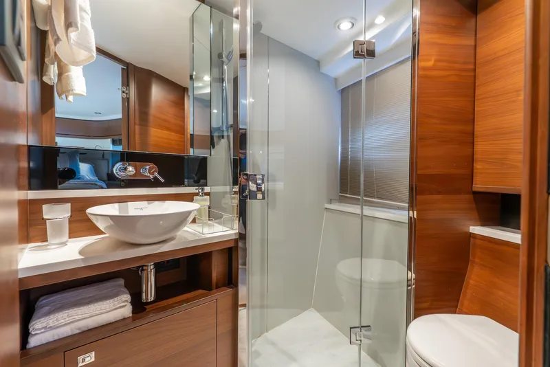 Slide: The Image of Luxurious bathroom in 2018 Princess F-68 yacht with modern fixtures and wooden accents. - 53