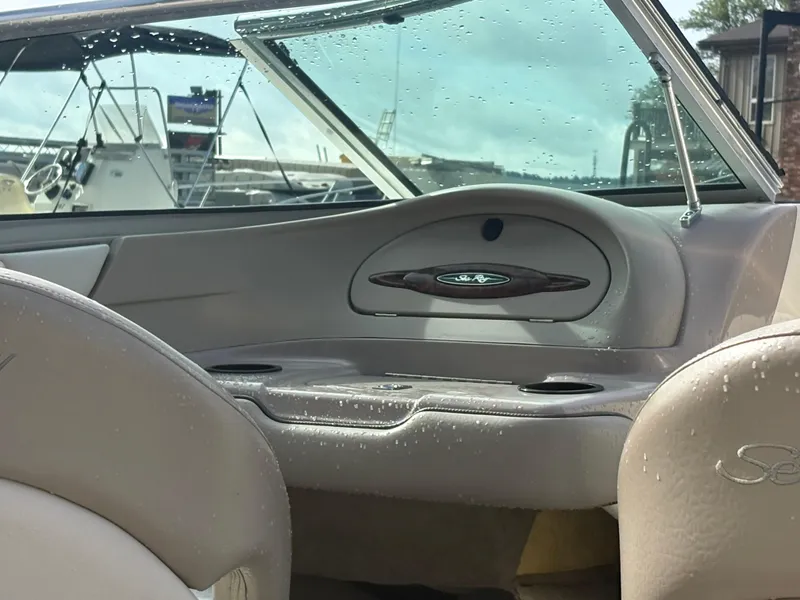 Slide: The Image of Interior view of a 2003 Sea Ray 200 Bow Rider boat with wet seats and dashboard. - 8
