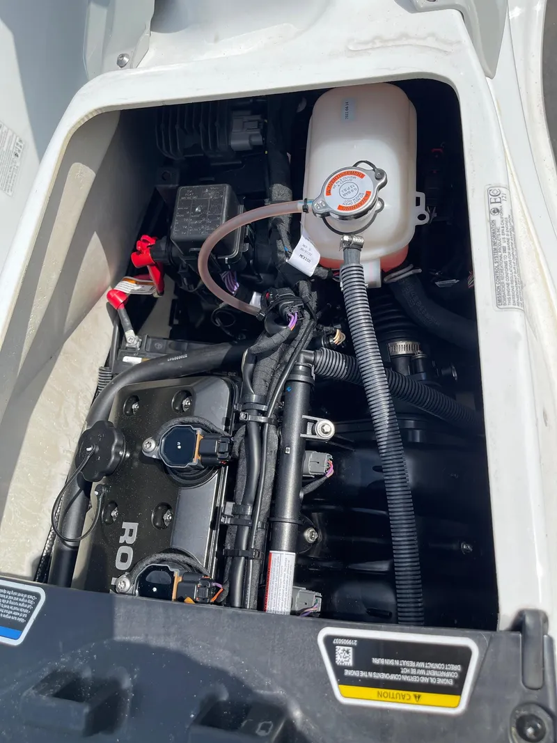 Slide: The Image of Engine compartment of a 2022 Sea-Doo Fishpro Sport 170, showcasing internal components. - 13