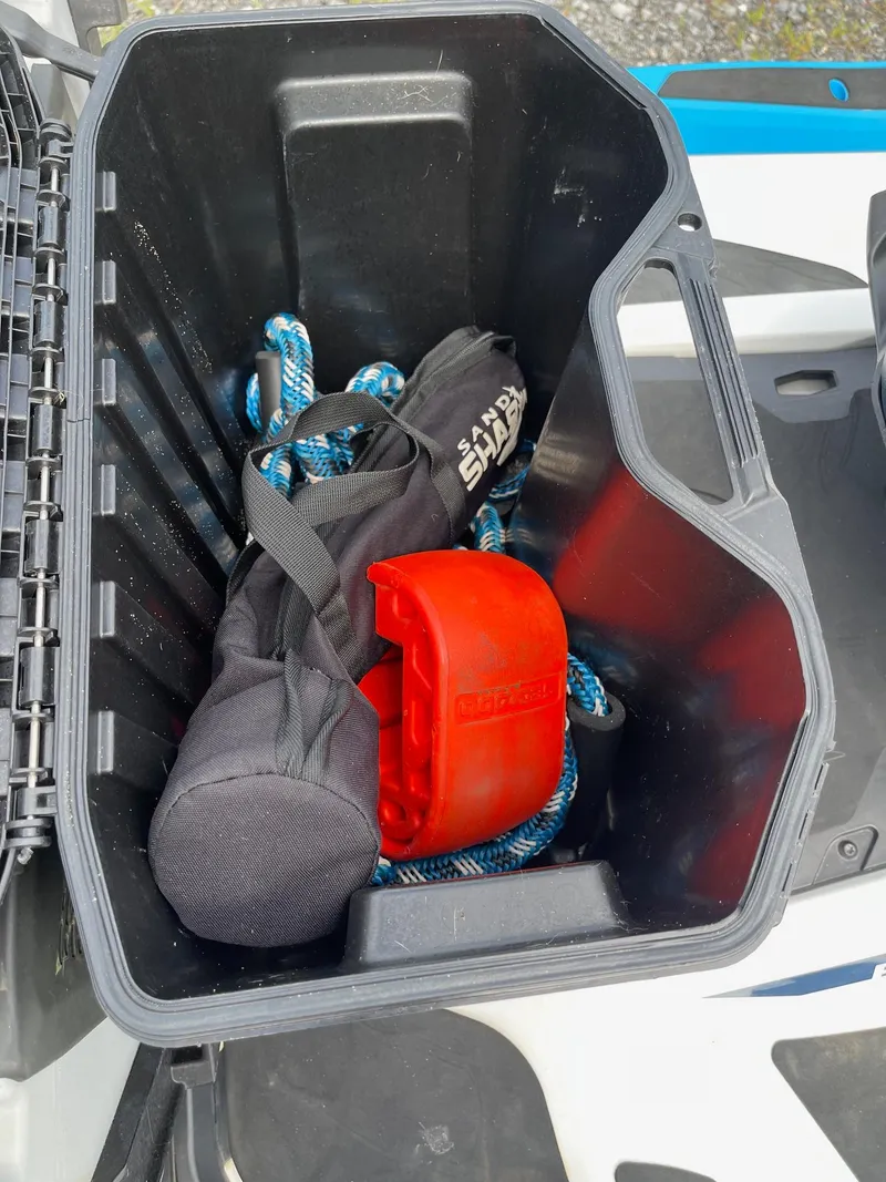 Slide: The Image of Storage compartment of 2022 Sea-Doo Fishpro Sport 170 with gear and accessories. - 16