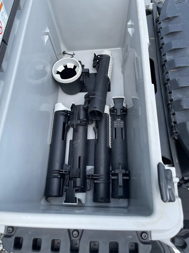 Slide: The Image of Storage compartment with fishing rod holders on a 2022 Sea-Doo Fishpro Sport 170. - 17