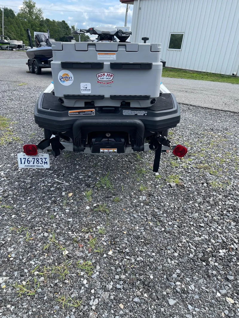 Slide: The Image of 2022 Sea-Doo Fishpro Sport 170 with storage box on gravel driveway. - 18