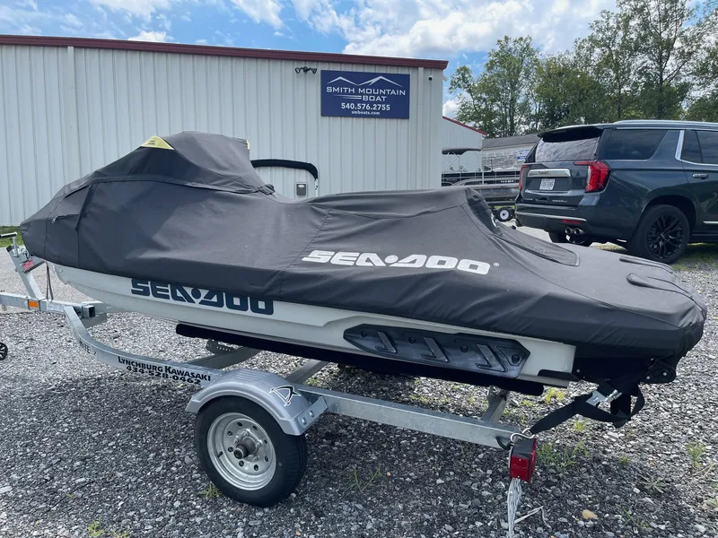 Slide: The Image of 2022 Sea-Doo Fishpro Sport 170 on trailer, covered, outside dealership. - 2