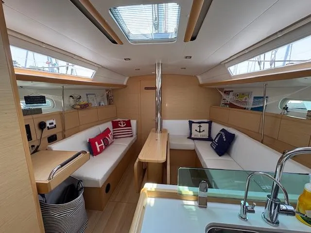 Slide: The Image of Interior of 2018 Jeanneau Sun Odyssey 389 sailboat with cozy seating and nautical decor. - 10