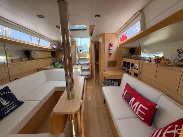 Slide: The Image of Interior of 2018 Jeanneau Sun Odyssey 389 yacht with modern furnishings and natural light. - 15