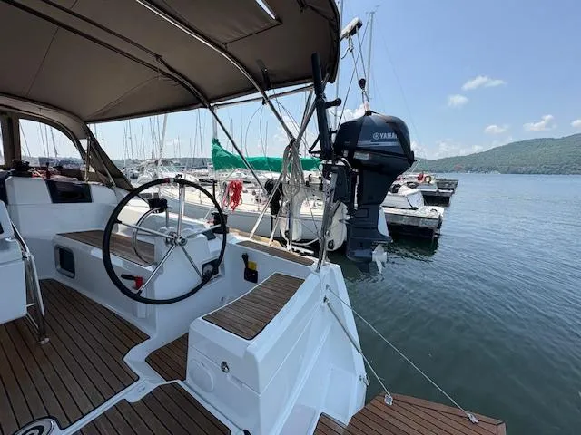 Slide: The Image of 2018 Jeanneau Sun Odyssey 389 sailboat with Yamaha motor, docked at marina. - 7