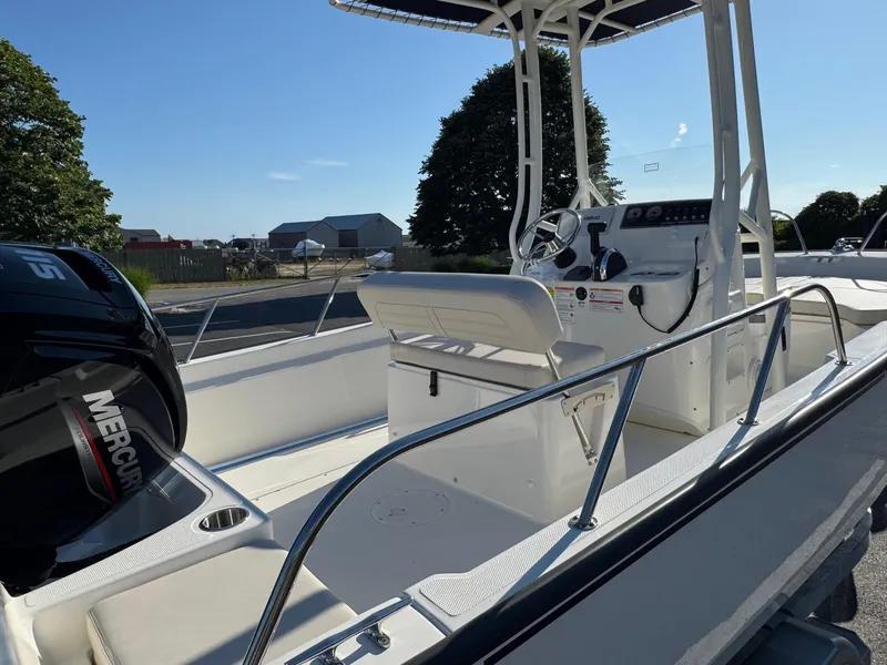 Slide: The Image of 2025 Boston Whaler 190 Montauk boat with Mercury engine, featuring a sleek console and seating. - 5