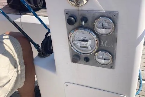 Slide: The Image of Control panel of a 2005 Morris M36 Daysailer with gauges and ropes visible. - 13