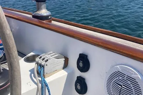 Slide: The Image of 2005 Morris M36 Daysailer deck with winch, cleats, and speaker by the water. - 14