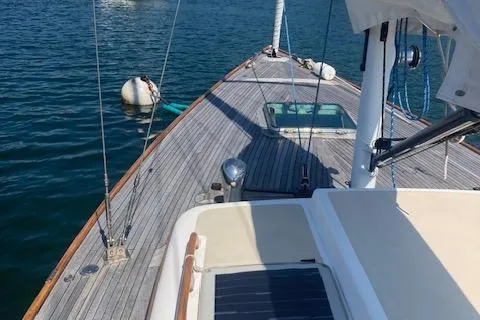 Slide: The Image of 2005 Morris M36 Daysailer on calm water, showcasing deck and rigging details. - 8