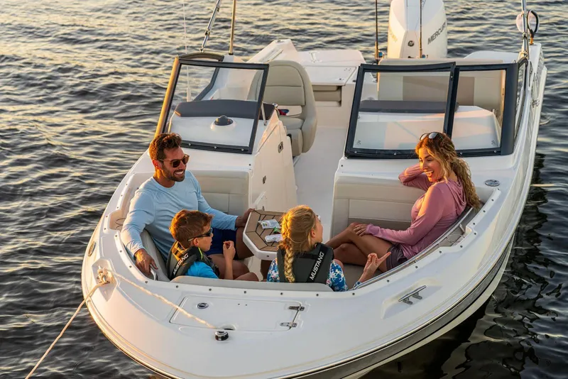Slide: The Image of Family enjoying a day on a 2025 Boston Whaler 210 Vantage boat. - 11