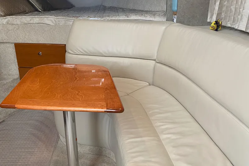 Slide: The Image of Luxurious interior of a 2012 Formula 31PC with leather seating and wooden table. - 11