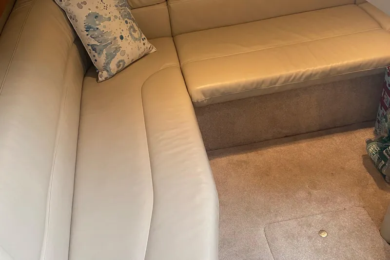 Slide: The Image of Luxurious beige leather seating in 2012 Formula 31PC boat interior. - 12