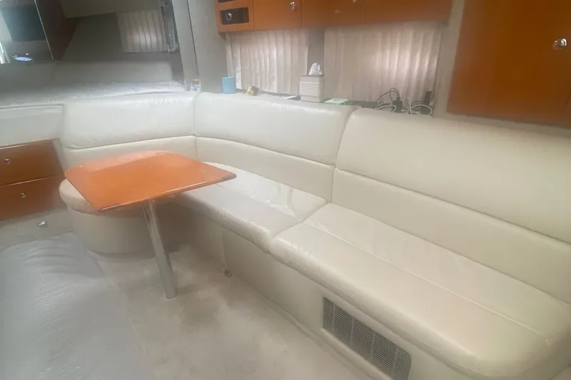 Slide: The Image of Interior of 2012 Formula 31PC yacht with white leather seating and wooden table. - 15