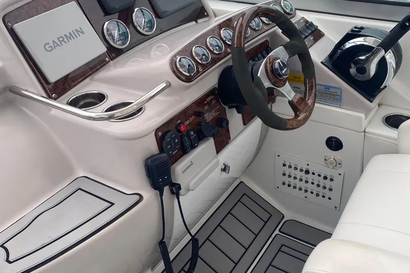 Slide: The Image of Cockpit of 2012 Formula 31PC boat with Garmin navigation and wood-accented steering wheel. - 18