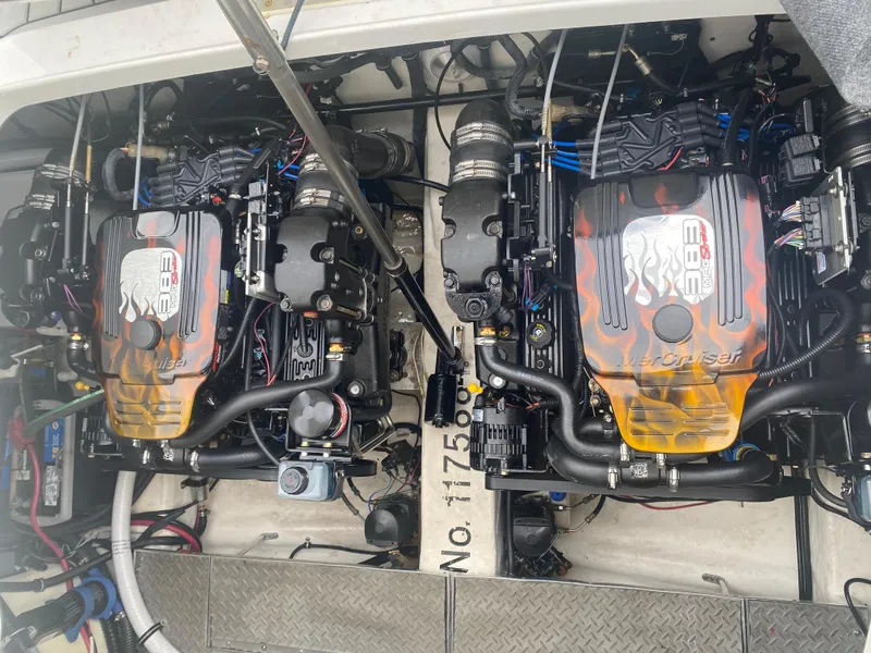 Slide: The Image of Twin engines in a 2012 Formula 31PC boat, showcasing detailed mechanics and design. - 21