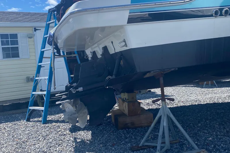 Slide: The Image of 2012 Formula 31PC boat on stands, with ladder and house in background. - 25