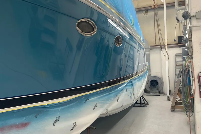 Slide: The Image of 2012 Formula 31PC boat in a workshop, undergoing maintenance or repair. - 9