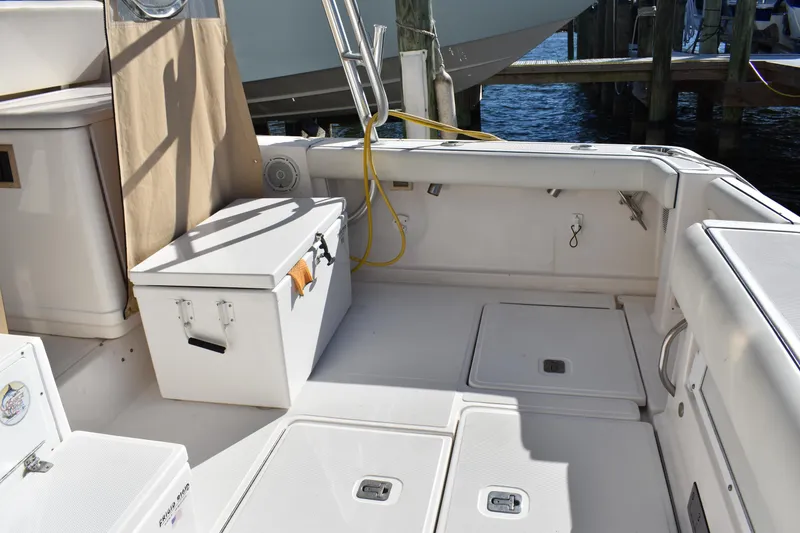 Slide: The Image of 2008 Tiara Sport Fish boat deck with storage and seating area. - 12