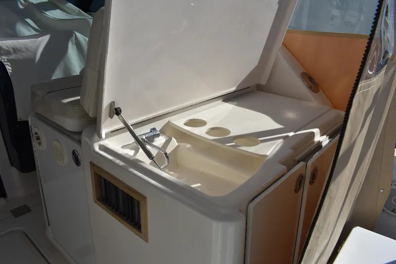 Slide: The Image of 2008 Tiara Sport Fish boat interior with open storage compartment. - 13