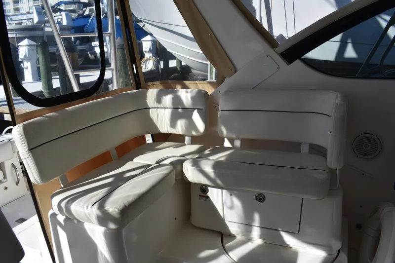 Slide: The Image of 2008 Tiara Sport Fish boat interior with white cushioned seating. - 14