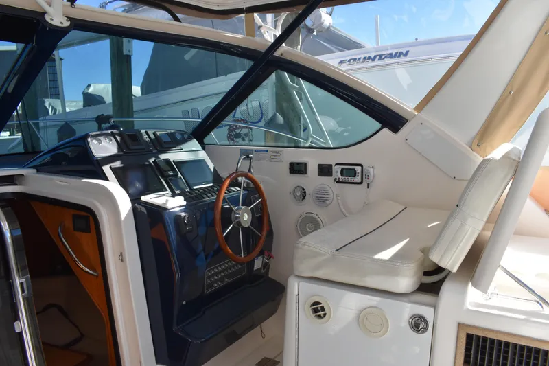 Slide: The Image of 2008 Tiara Sport Fish boat interior with steering wheel and control panel. - 15