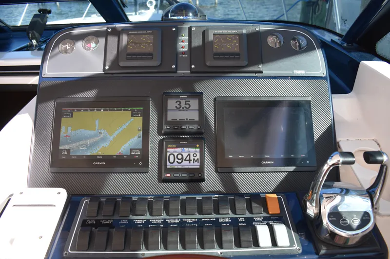 Slide: The Image of Dashboard of a 2008 Tiara Sport Fish boat with navigation and control systems. - 16
