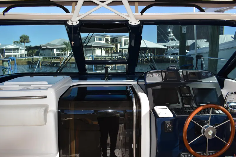 Slide: The Image of 2008 Tiara Sport Fish boat interior with modern dashboard and steering wheel. - 18