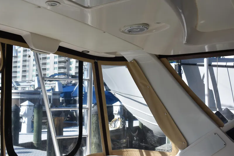 Slide: The Image of Interior view of 2008 Tiara Sport Fish boat with marina background. - 21
