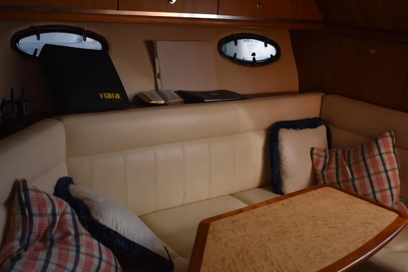 Slide: The Image of 2008 Tiara Sport Fish interior with cozy seating and nautical decor. - 23