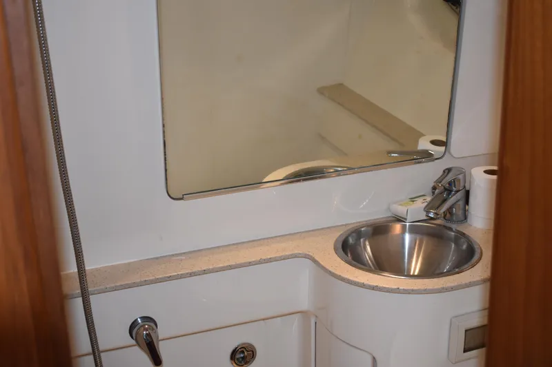 Slide: The Image of 2008 Tiara Sport Fish boat bathroom with sink and mirror. - 28