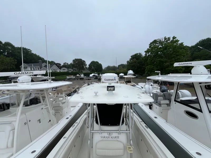 Slide: The Image of 2007 Hydra-Sports 2500CC boat docked with Garmin equipment, surrounded by other boats. - 13
