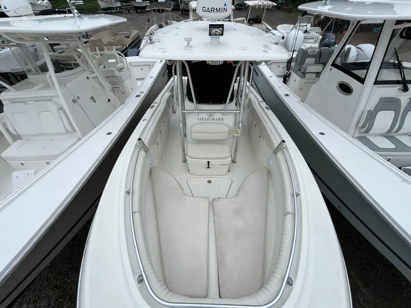 Slide: The Image of 2007 Hydra-Sports 2500CC boat with spacious deck and seating, docked among other boats. - 14
