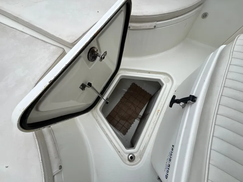 Slide: The Image of Open storage compartment on a 2007 Hydra-Sports 2500CC boat deck. - 16