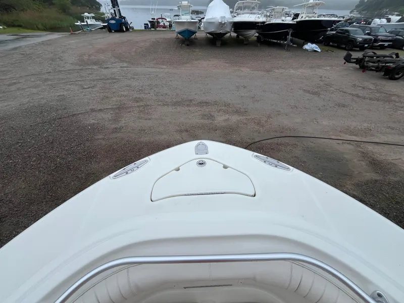 Slide: The Image of 2007 Hydra-Sports 2500CC boat on a gravel lot with other boats. - 21