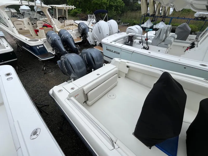 Slide: The Image of 2007 Hydra-Sports 2500CC boat with Yamaha outboard engines in a marina setting. - 25