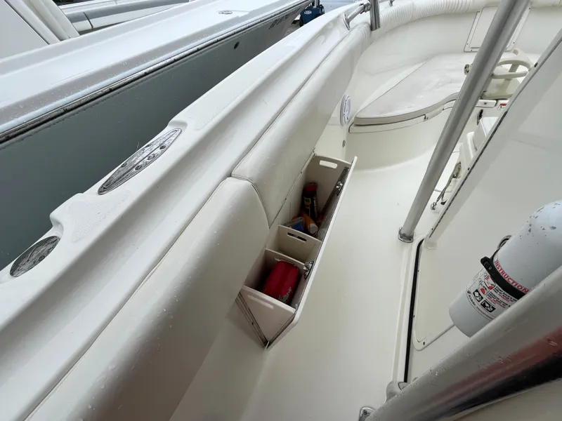 Slide: The Image of 2007 Hydra-Sports 2500CC boat interior with storage compartments and safety equipment. - 26