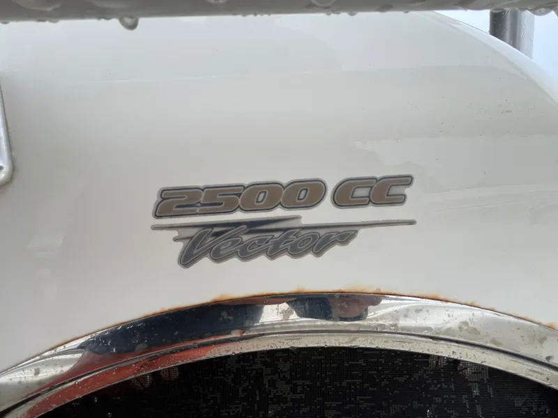 Slide: The Image of 2007 Hydra-Sports 2500CC Vector logo on white boat surface. - 29