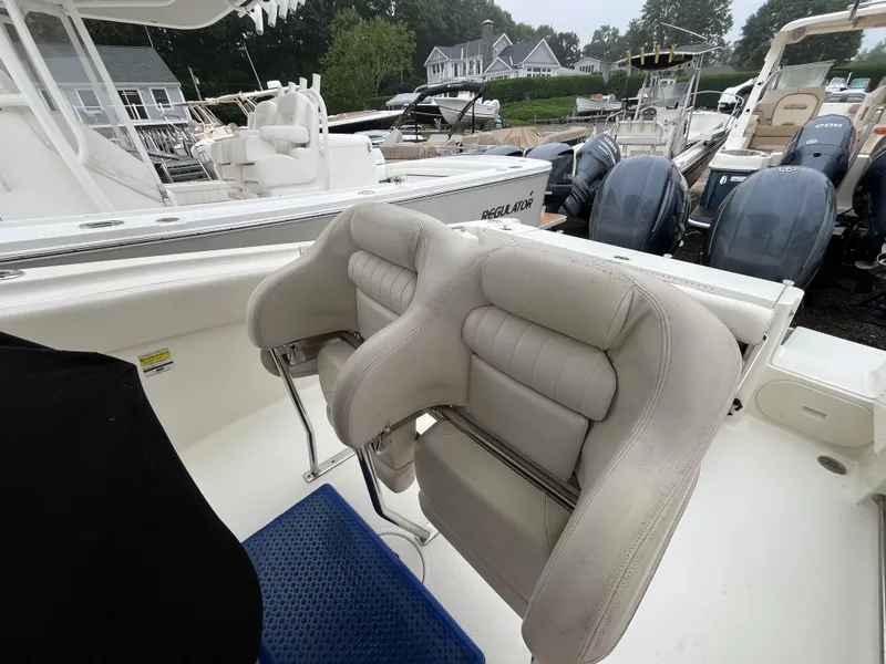 Slide: The Image of 2007 Hydra-Sports 2500CC boat interior with cushioned seating and dual outboard motors. - 35