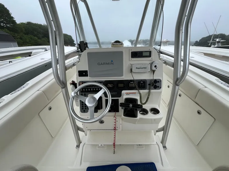 Slide: The Image of 2007 Hydra-Sports 2500CC boat console with Garmin and Raymarine electronics, steering wheel, and controls. - 36