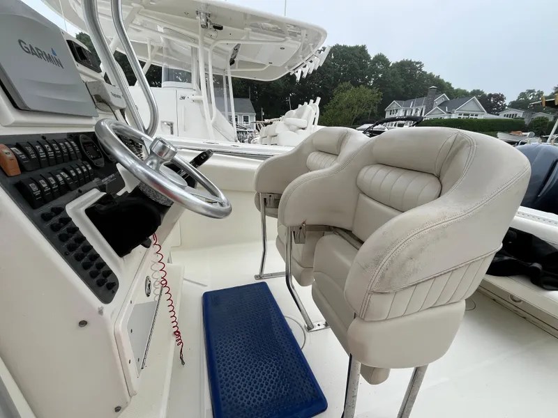 Slide: The Image of 2007 Hydra-Sports 2500CC boat interior with steering wheel and cushioned seats. - 38