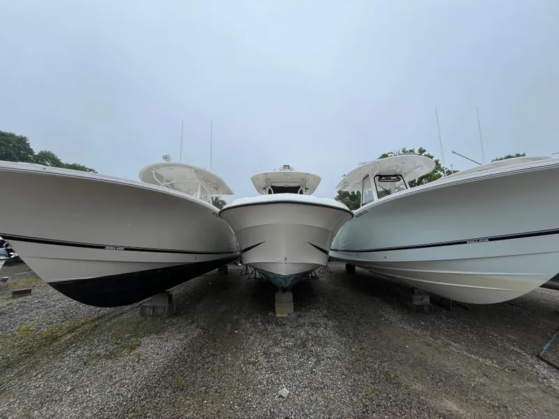 Slide: The Image of Three boats on land, featuring a 2007 Hydra-Sports 2500CC, displayed side by side. - 4