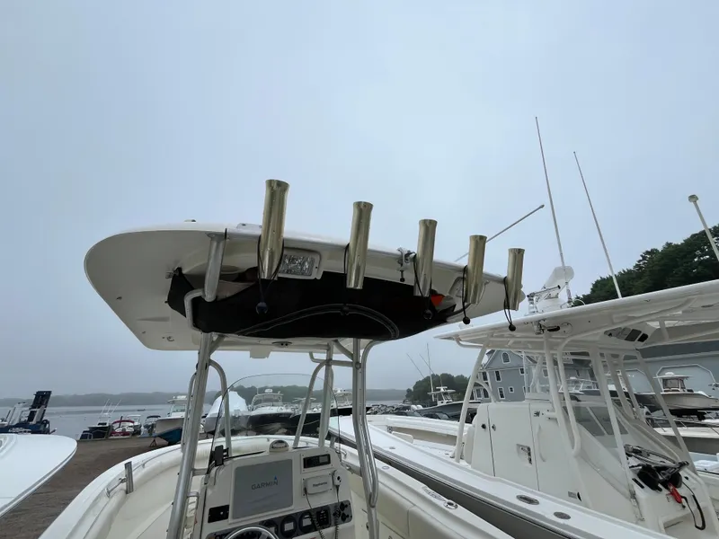 Slide: The Image of 2007 Hydra-Sports 2500CC boat with rod holders and Garmin navigation system at a marina. - 42