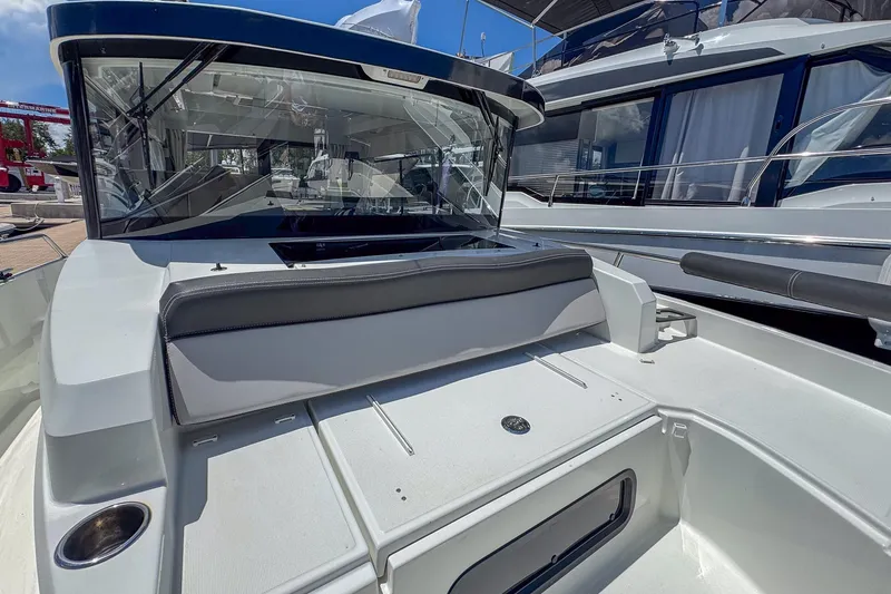 Slide: The Image of 2018 Jeanneau NC 895 boat deck with seating and windshield. - 34