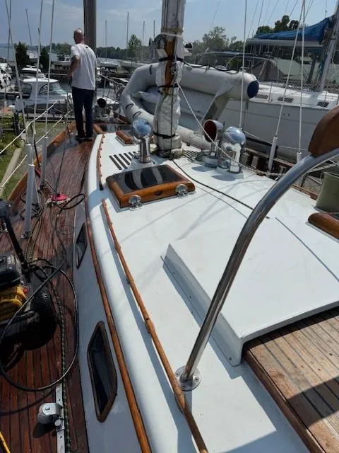 Slide: The Image of 1978 Cheoy Lee Off Shore 41 sailboat deck with wooden accents and rigging. - 3